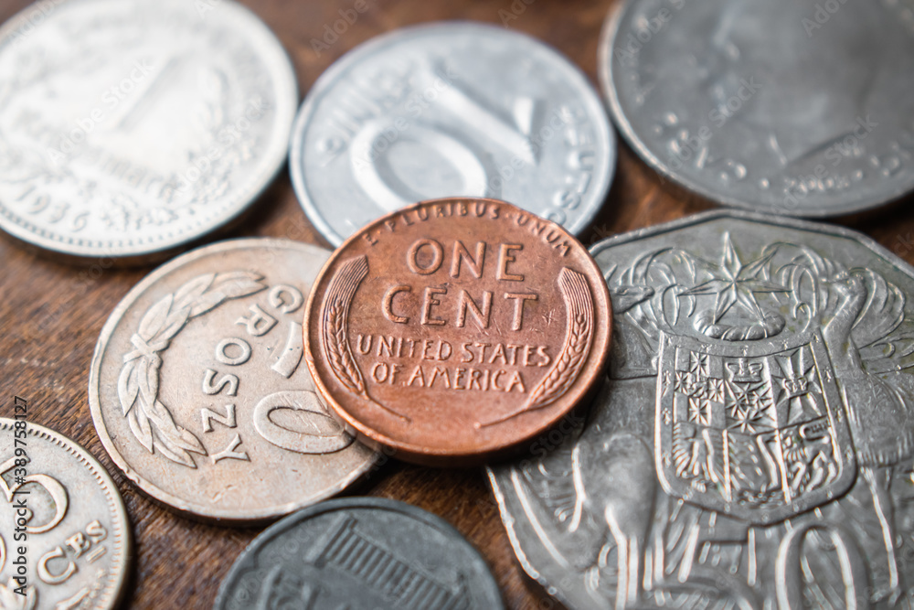 Stack of old coins with historical one cent from U.S. America on wooden background Stack of old coins with historical one cent from U.S. America on wooden background
