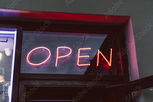 neon sign open street showcase door red light welcome photo