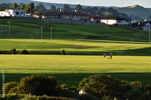 AUCKLAND, NEW ZEALAND - Apr 10, 2019: Macleans College grounds with houses and Rangitoto volcanic island in background photo