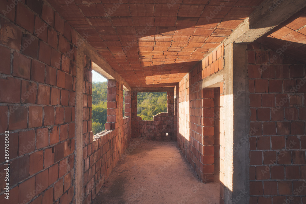 Obraz premium House construction interior with red bricks