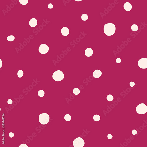 Cute hand drawn white snow polka dots seamless pattern on dark red background. Christmas snowflakes. Great for winter fabric, textile, nursery decoration, Christmas wrapping paper, scrapbooking
