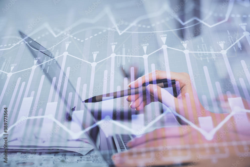 Multi exposure of woman hands typing on computer and financial graph hologram drawing. Stock market analysis concept. Multi exposure of woman hands typing on computer and financial graph hologram drawing. Stock market analysis concept.