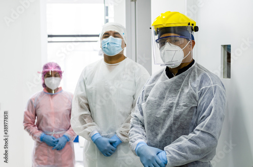A group of doctors in protective suit against the virus