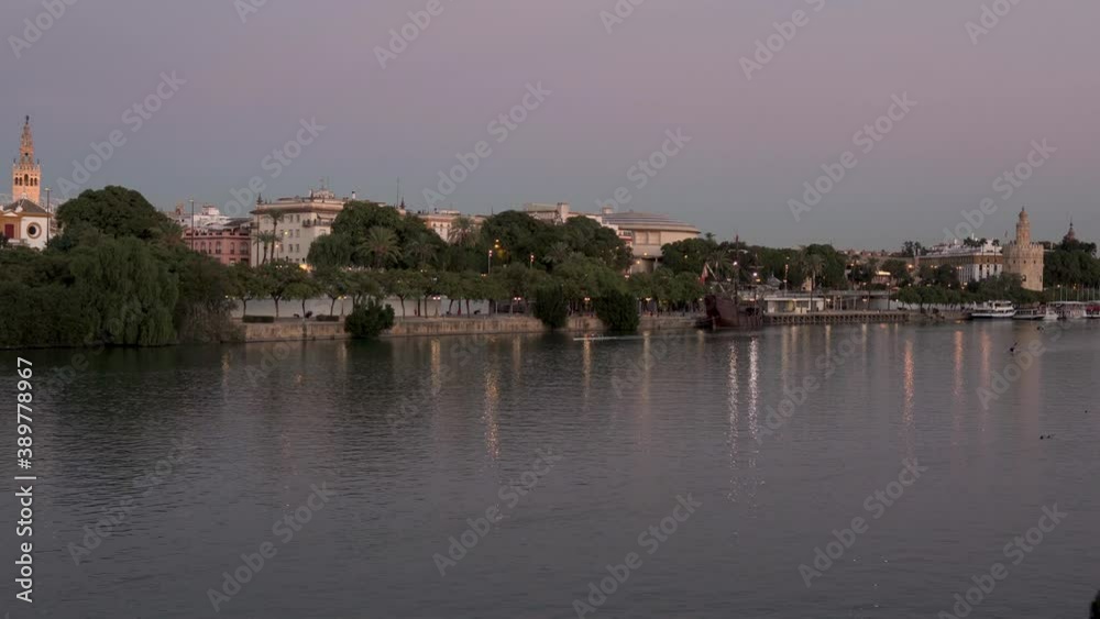 river of a city with Roman architecture, kayaking and canoeing are tourist activities in Seville, Spain river of a city with Roman architecture, kayaking and canoeing are tourist activities in Seville, Spain