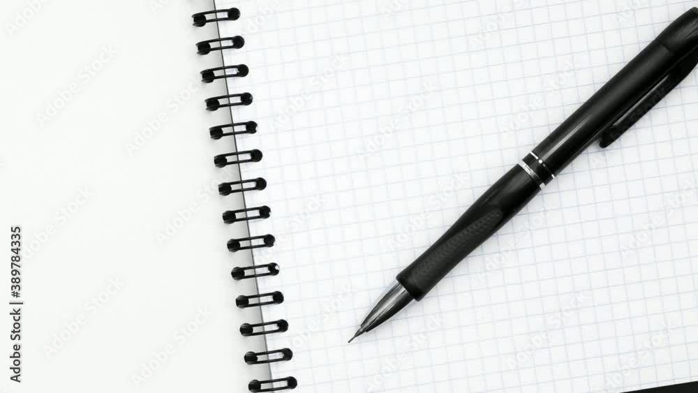 Blank sheet of open notebook and black mechanical pencil. Blank sheet of open notebook and black mechanical pencil.