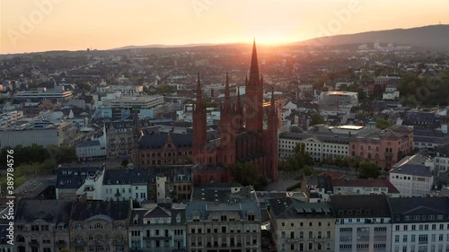 Circling around the Marktkirche in Wiesbaden Germany on a late summer evening in low light with a drohne