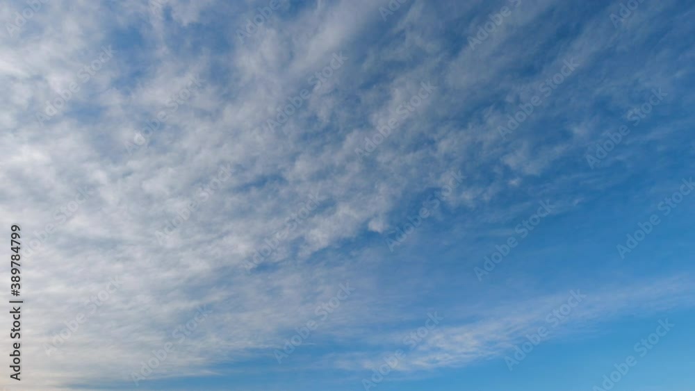 Clouds move smoothly in the blue sky. Time lapse. Clouds move smoothly in the blue sky. Time lapse.
