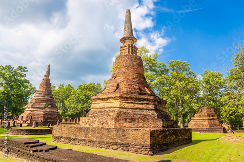 Landmark of old chedi made of ancient bricks in the Kamphaeng Phet Historical Park, Thailand.