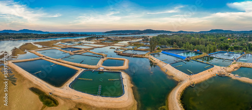 Aerial view of  white shrimp ( prawn ) farm with aerator pump in front of Tuy...