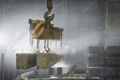 Canvas Print The crane moves a reinforced concrete product with holes