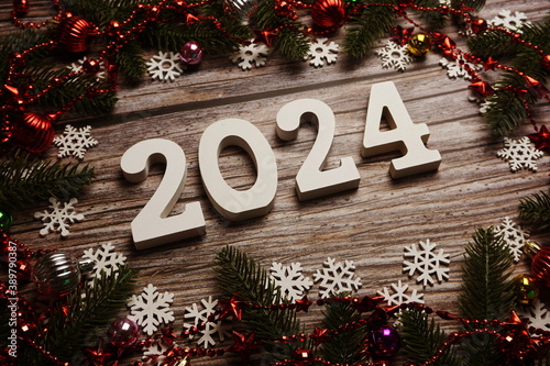 2024 Happy New Year and Christmas decoration on wooden background © may1985