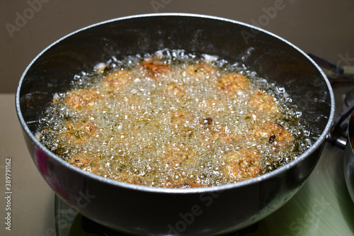 cooking INDIAN CHINESE DRY and crispy GOBI MANCHURIAN BALLS frying manchurian balls in oil vessel