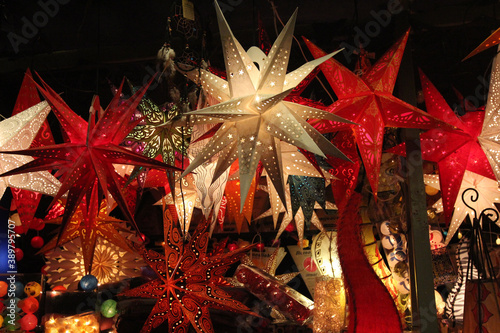 Low angle shot of lit star-shaped lanterns photo