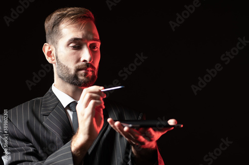 A man in a business suit ho...
