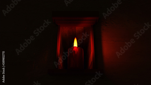 Eine Kerze steht in einer Niesche, verbreitet angenehm warmes, beruhigendes Licht in der Nacht