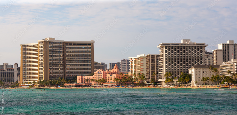 Hotel buildings and beach-goers along Waikiki Beach, Oahu, Hawaii Hotel buildings and beach-goers along Waikiki Beach, Oahu, Hawaii