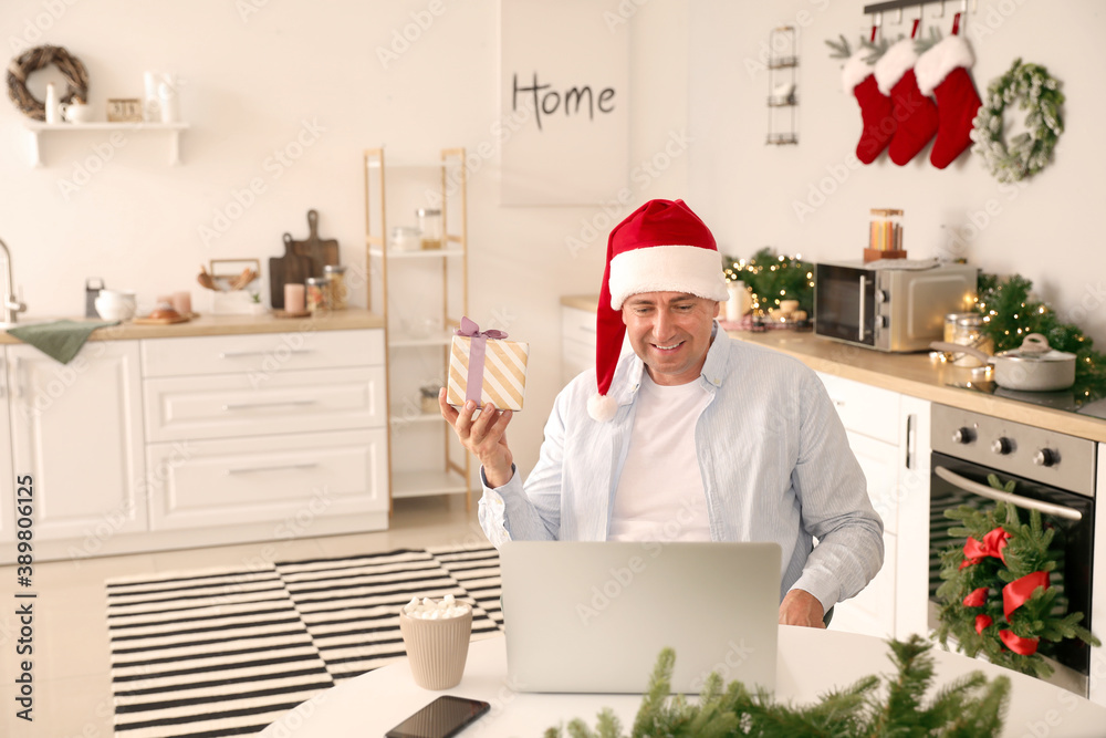 Man celebrating Christmas at home due to coronavirus epidemic Man celebrating Christmas at home due to coronavirus epidemic
