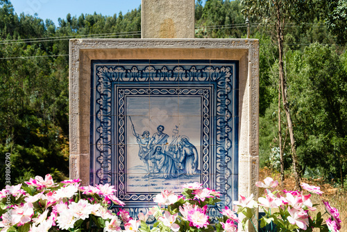 Close up shot of a tile in a church cross in north of portugal. photo