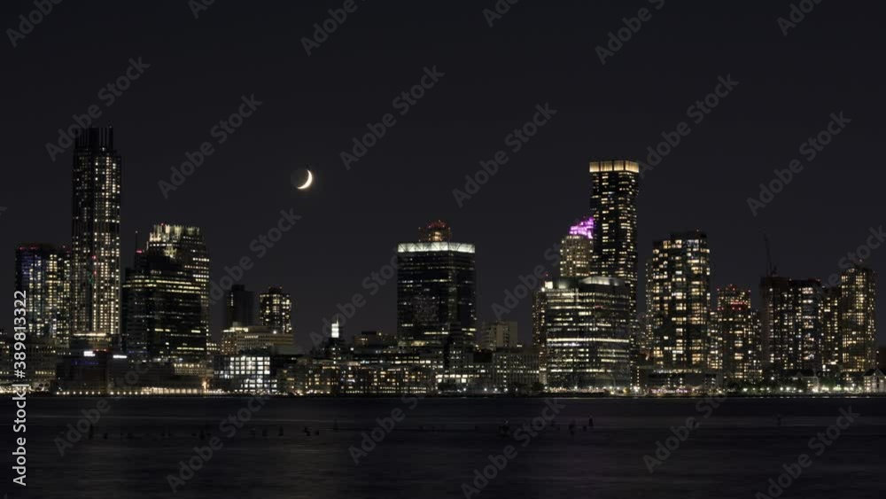 Crescent Waxing moon set over Jersey city Skyline Crescent Waxing moon set over Jersey city Skyline