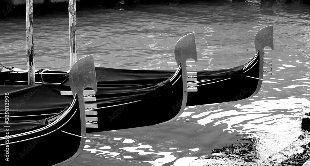Venice, Italy, December 28, 2018 evocative image gondolas moored in a canal
