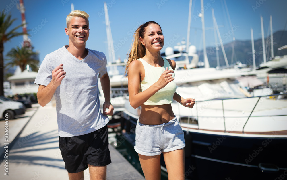 Obraz premium Friends running fitness training together outdoors living active healthy