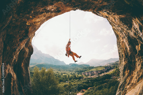 Rock climber hanging on a rope.