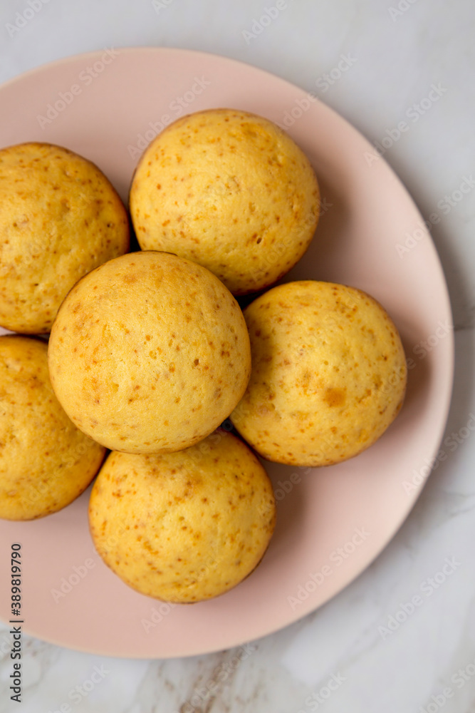 Homemade Cornbread Muffins on a pink plate, top view. Flat lay, overhead, from above. Close-up. Homemade Cornbread Muffins on a pink plate, top view. Flat lay, overhead, from above. Close-up.