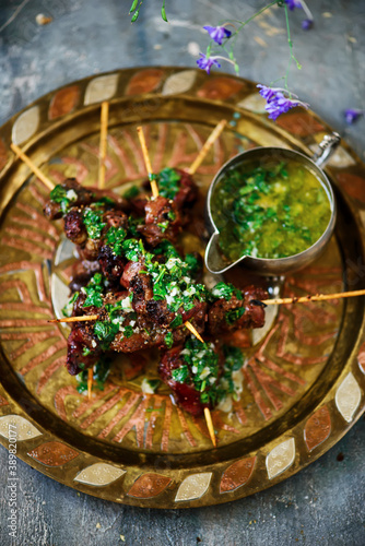 Grilled chicken liver skewers with lemon butter sauce..