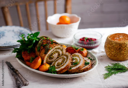 Turkey porchetta with caramelised clementines on the Christmas background .style rustic. photo