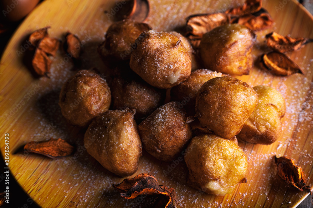 Bunuelos de viento - traditional Colombian sweet deep fried pastry. Spanish Easter doughnut. Mexican golden, crispy-sweet, tortilla-like fritters are sprinkled with sugar Bunuelos de viento - traditional Colombian sweet deep fried pastry. Spanish Easter doughnut. Mexican golden, crispy-sweet, tortilla-like fritters are sprinkled with sugar