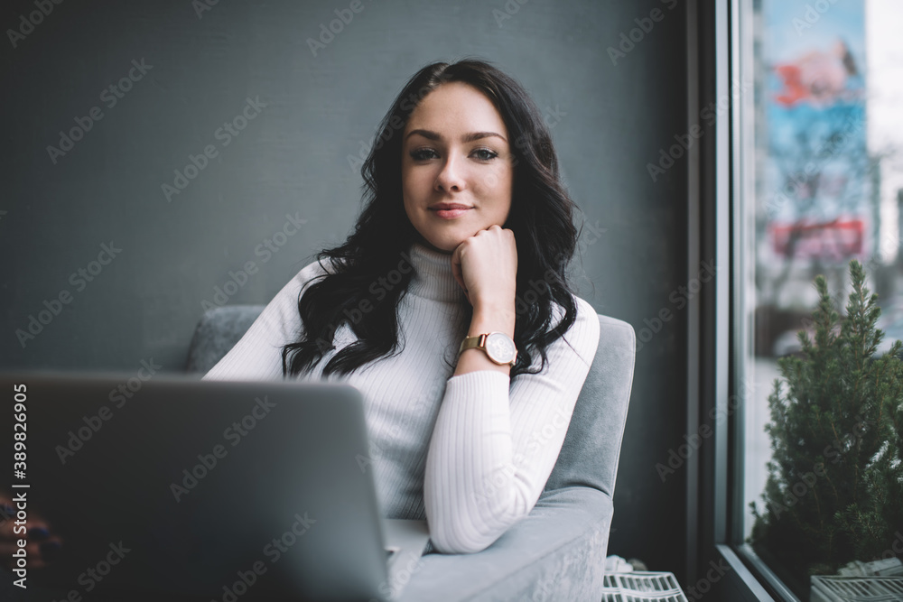 Thoughtful brunette sitting in front of laptop Thoughtful brunette sitting in front of laptop