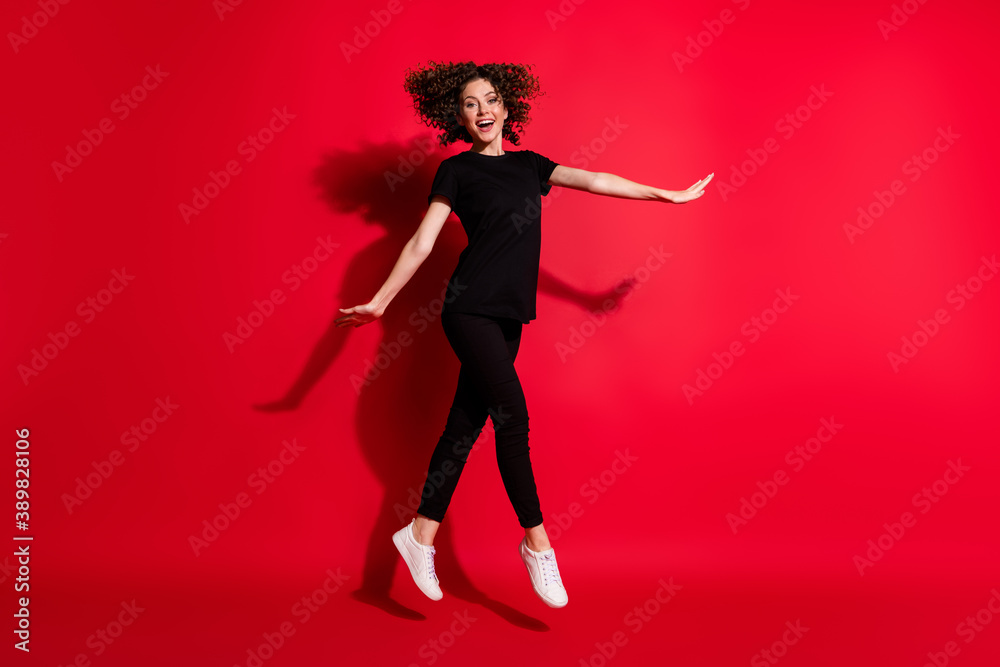 Photo portrait full body view of girl dancing ballet jumping up isolated on vivid red colored background Photo portrait full body view of girl dancing ballet jumping up isolated on vivid red colored background