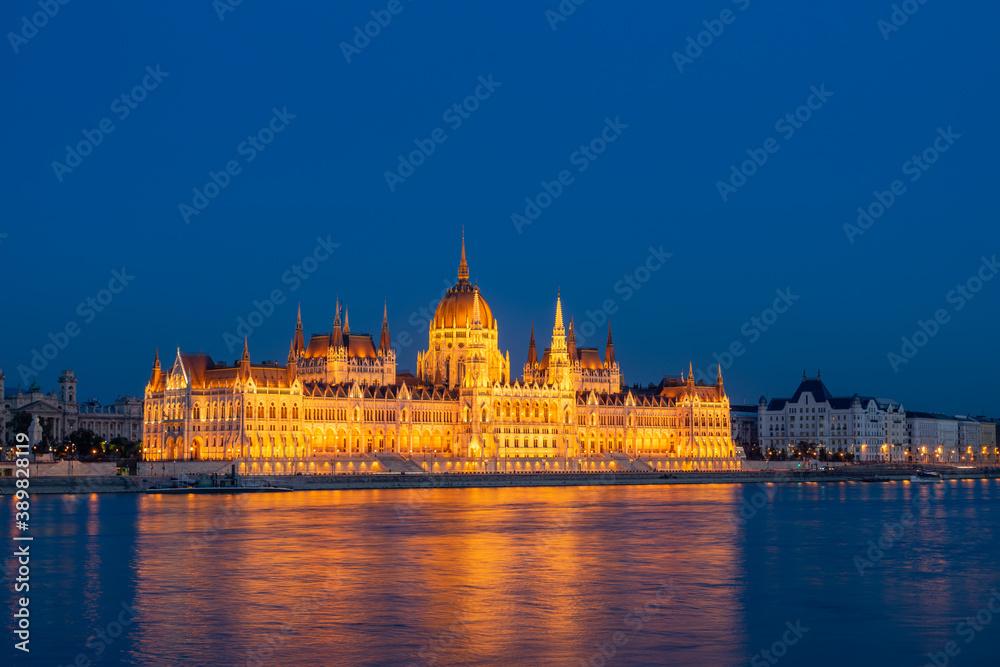 Budapest parliament on the Danube banks at dusk, Hungary