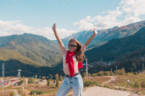 Young woman in Sochi with mountain view on the background, Russia.