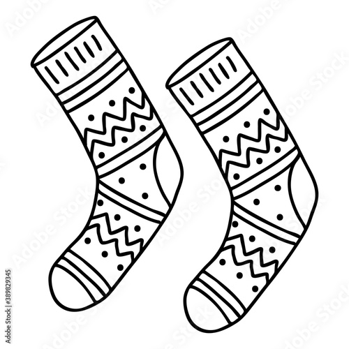 A pair of warm socks with a Doodle pattern. The sketch is hand-drawn and isolated on a white background. Element of new year and Christmas design. Outline drawing. Black-white vector illustration