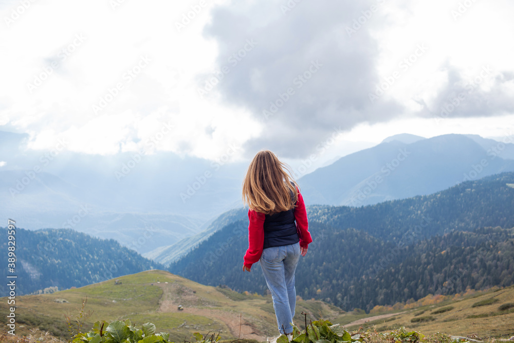 Young woman on a mountain hike in Sochi, Russia.