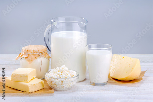 Various dairy products on white wooden surface. Concept natural thealthy food.