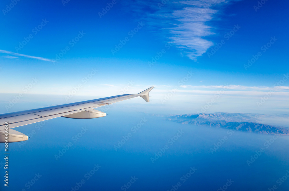 Amazing view from the plane window at the sky.Flight over the aegean sea.