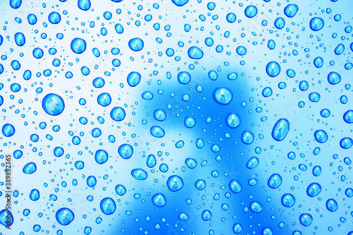 Big raindrops on blue and white background
