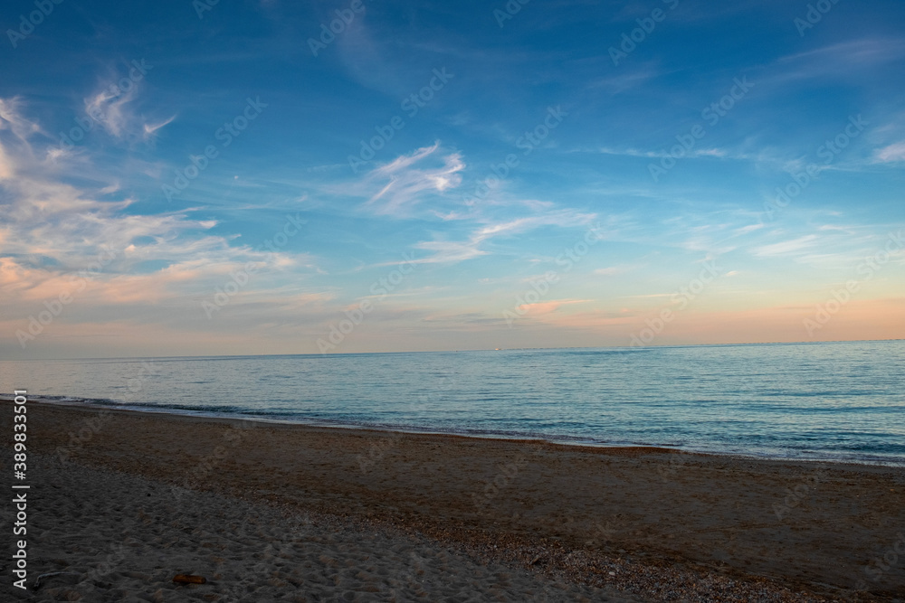 Panoramic view of the sea beach in sunset light.