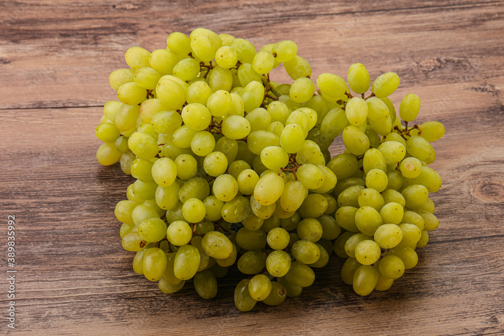 Green grape branch over background Green grape branch over background
