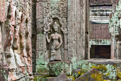 statue of a Devata deities with an enigmatic smile in Preah Khan temple, in Angkor Thom in Siem Reap Cambodia