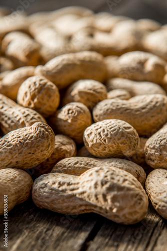 Dried peanuts closeup photo. Peanut in the shell. Food background of peanuts, healthy vegan food