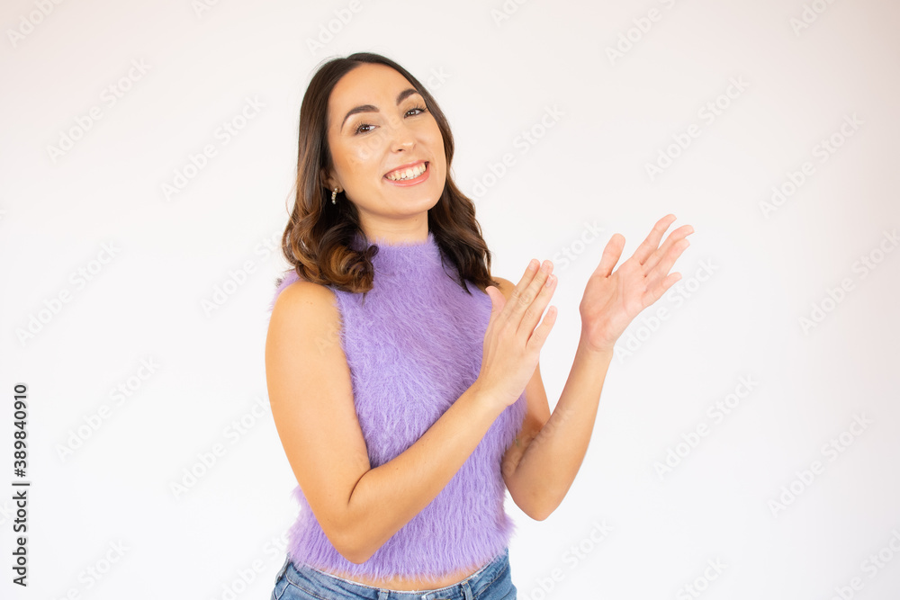 Portrait of smiling young lady giving applause to somebody on white background. She clapping her hands. Portrait of smiling young lady giving applause to somebody on white background. She clapping her hands.