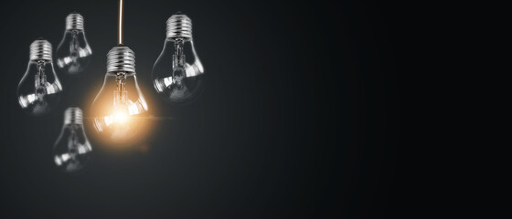 Abstract hand holding creative light lightbulb on isolated black background Present futuristic digital technology knowledge education Concept of transformation innovation invention discovery