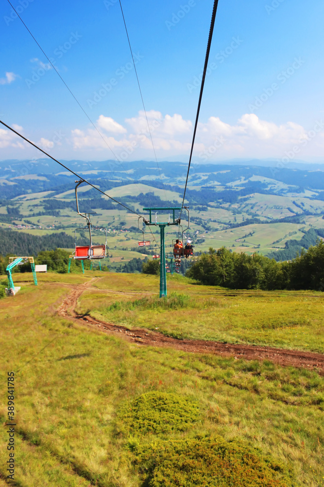 Ski lift that takes tourists and skiers to the top of the Borzhava ridge in Carpathian mountains, Transcarpathia, Western Ukraine. Amazing vacation in the Ukrainian mountains. Mountainous countryside