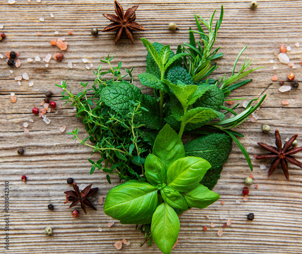 Fresh herbs and spices on wooden background top view Fresh herbs and spices on wooden background top view