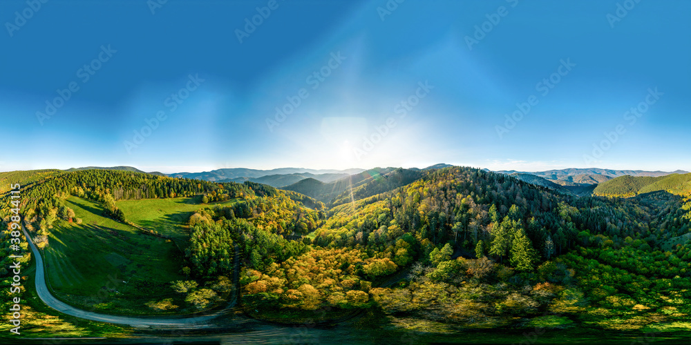 360-degree panoramic view above a multi-colored valley in the Vosges.