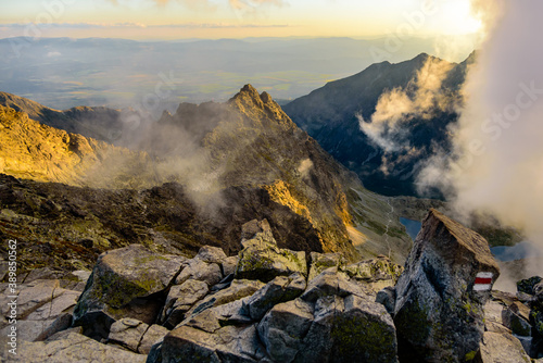 Fototapeta Naklejka Na Ścianę i Meble -  At the top of the highest mountain in polish High Tatras mountains Rysy at hight 2499m above sea level during a beautiful sunset.