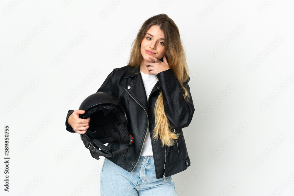 Woman holding a motorcycle helmet isolated on white background thinking Woman holding a motorcycle helmet isolated on white background thinking